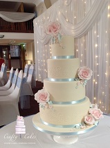 4 tier blush pink & blue wedding cake with sugar roses